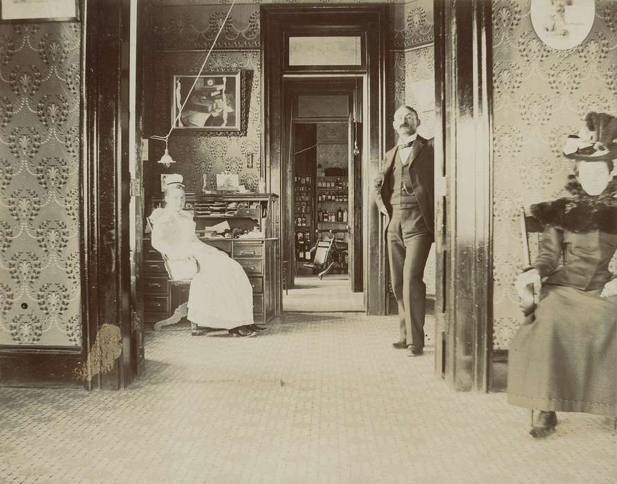 Portraits - Group, doorway, doctor, waiting room, dr. william a. rohlf, glasses, nurse, Hospitals, dress, mustache, picture, hat, Waverly Public Library, history of Iowa, Iowa History, bottle, Waverly, IA, wallpaper, office, Iowa, correct date needed