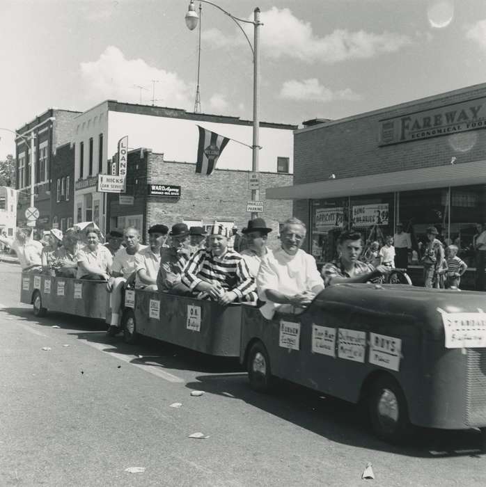 Portraits - Group, flag, Main Streets & Town Squares, history of Iowa, Iowa History, street sign, Motorized Vehicles, Businesses and Factories, brick building, crowd, Waverly, IA, Fairs and Festivals, costume, Iowa, correct date needed, Waverly Public Library