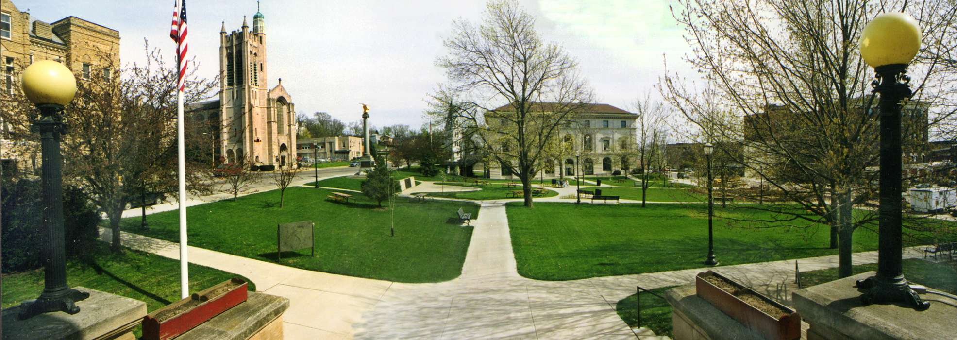 flag, Main Streets & Town Squares, history of Iowa, Iowa History, Ottumwa, IA, Lemberger, LeAnn, Businesses and Factories, park bench, street light, Iowa, Cities and Towns, church, tree, park