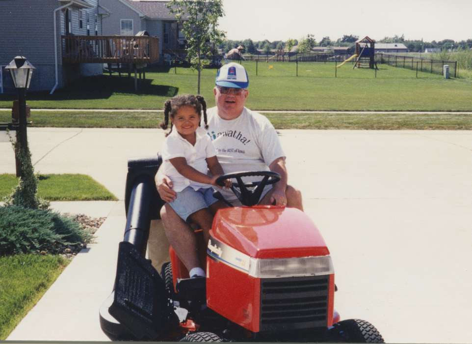 Portraits - Group, IA, Iowa, driveway, Theis, Virginia, Children, african american, People of Color, lawn mower, Cities and Towns, history of Iowa, Motorized Vehicles, Iowa History