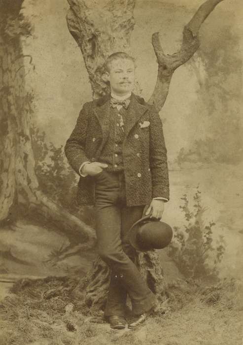 sack coat, pocket watch chain, handkerchief, Mount Pleasant, IA, Iowa, bowler hat, Iowa History, Olsson, Ann and Jons, Portraits - Individual, history of Iowa, painted backdrop, man, bow tie, cabinet photo, tree