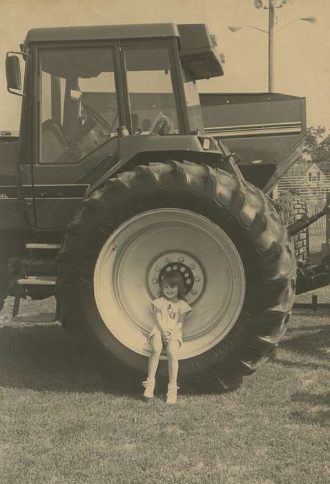 history of Iowa, Iowa History, girl, Motorized Vehicles, smile, outfit, tractor, Fairs and Festivals, Waverly, IA, grass, Iowa, correct date needed, Children, Waverly Public Library, Portraits - Individual