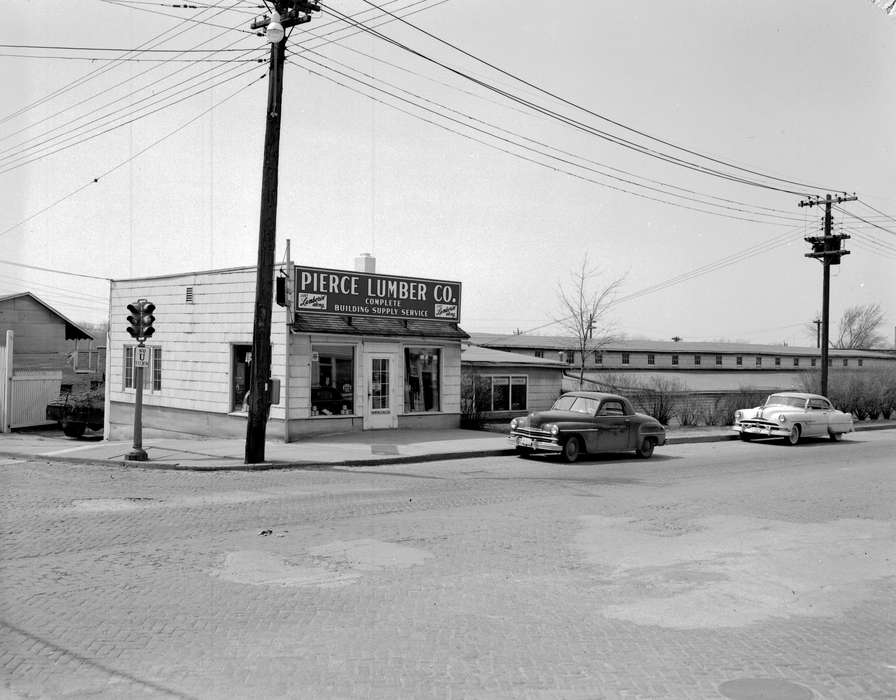 telephone pole, Main Streets & Town Squares, history of Iowa, brick road, Ottumwa, IA, Iowa History, Lemberger, LeAnn, Motorized Vehicles, Businesses and Factories, car, Iowa, Cities and Towns, stoplight, lumber