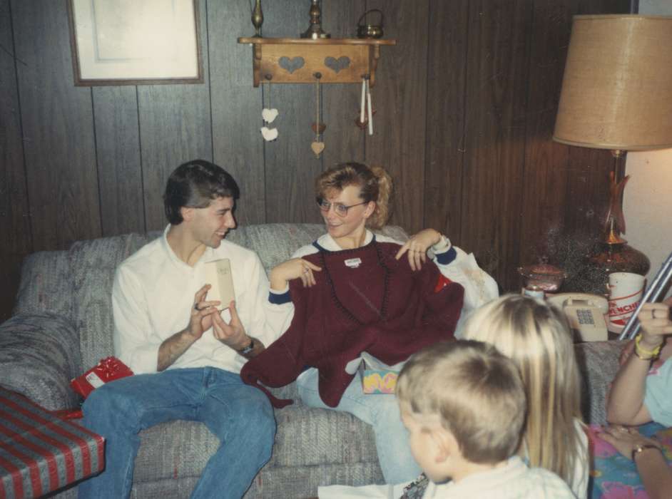 wood paneling, gift, Gehlsen, Katie, christmas, woman, Iowa History, Iowa, living room, denim, history of Iowa, man, Denison, IA, Homes, sweater, Holidays