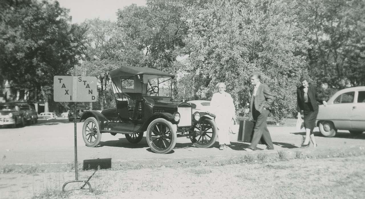 Portraits - Group, suitcase, taxi stand, Elderkin, Don, Iowa History, Iowa, Motorized Vehicles, IA, history of Iowa, sign