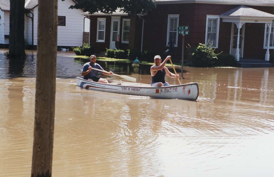 Portraits - Group, canoe, Waverly Public Library, Floods, history of Iowa, Iowa History, street sign, Families, summer, Waverly, IA, water, Iowa, Outdoor Recreation, boat, Sports, fire hydrant, Leisure