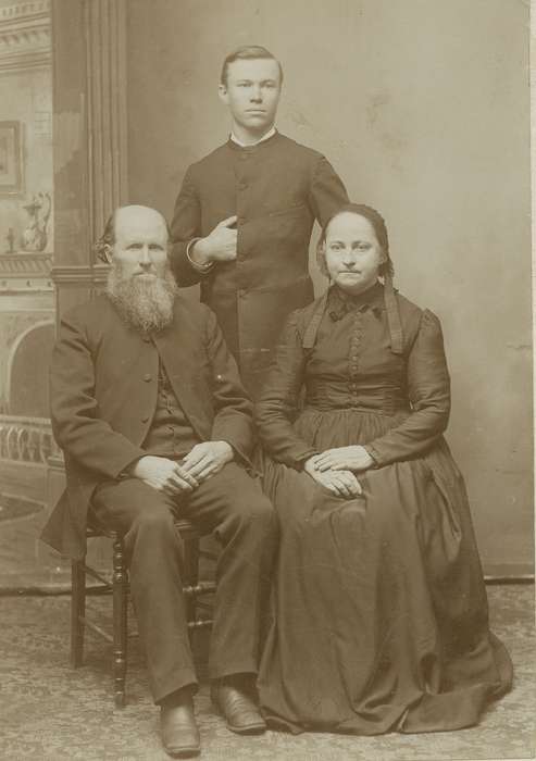 woman, bonnet, frock coat, beard, family, man, history of Iowa, cabinet photo, ribbon, Iowa History, Portraits - Group, Iowa, vest, Waterloo, IA, Families, Olsson, Ann and Jons, dress, hairnet, painted backdrop