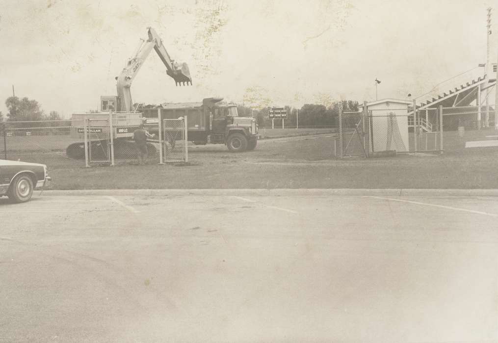 track, construction, bleacher, history of Iowa, man, Waverly Public Library, Waverly, IA, Iowa, Motorized Vehicles, fence, parking lot, Iowa History, correct date needed, Labor and Occupations