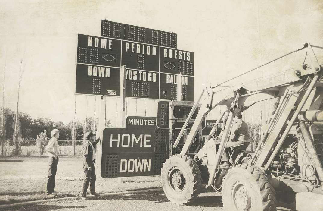 field, history of Iowa, football field, scoreboard, Waverly Public Library, Waverly, IA, Iowa, Motorized Vehicles, installation, men, Iowa History, people, Labor and Occupations