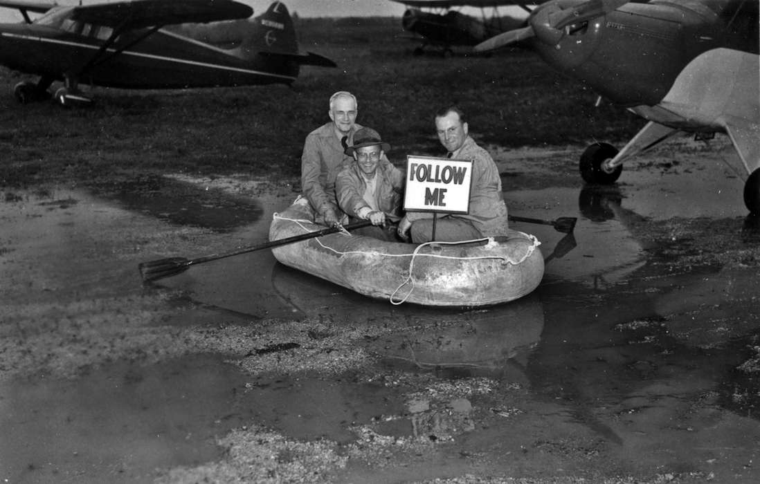 Lemberger, LeAnn, puddle, airplane, Motorized Vehicles, mud, Iowa History, Leisure, Iowa, history of Iowa, plane, Portraits - Group, Ottumwa, IA, boat, sign, oar