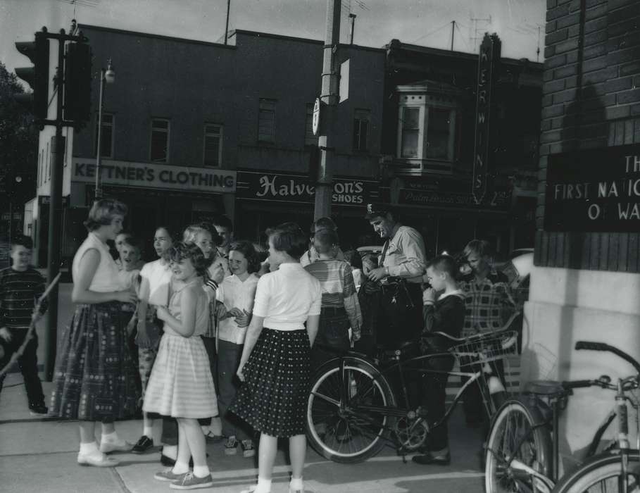 Children, history of Iowa, Waverly Public Library, storefront, Iowa, Civic Engagement, bikes, crowd, Iowa History, traffic light, correct date needed, police officer