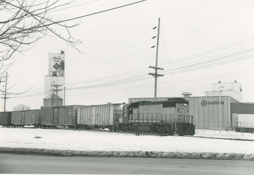 history of Iowa, Iowa History, factory, carnation, Winter, Motorized Vehicles, Businesses and Factories, Waverly, IA, winter, Iowa, train, power line, snow, Waverly Public Library