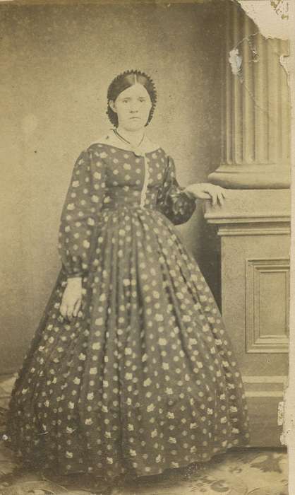 carte de visite, Iowa, necklace, pattern carpet, pattern dress, woman, column, hoop skirt, pillar, Portraits - Individual, dress, hairnet, Olsson, Ann and Jons, Decorah, IA, history of Iowa, dropped shoulder seams, Iowa History