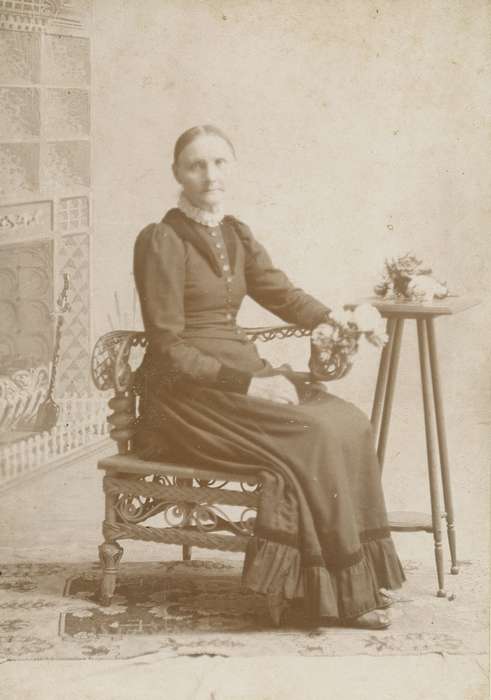 Iowa, flowers, woman, Marengo, IA, Olsson, Ann and Jons, Portraits - Individual, dress, painted backdrop, lace collar, history of Iowa, cabinet photo, wicker chair, Iowa History