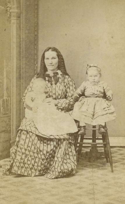 Portraits - Group, baby, carte de visite, Iowa, woman, high chair, children, Children, highchair, Olsson, Ann and Jons, dress, Ackley, IA, history of Iowa, girl, bow tie, dropped shoulder seams, ribbon, Iowa History