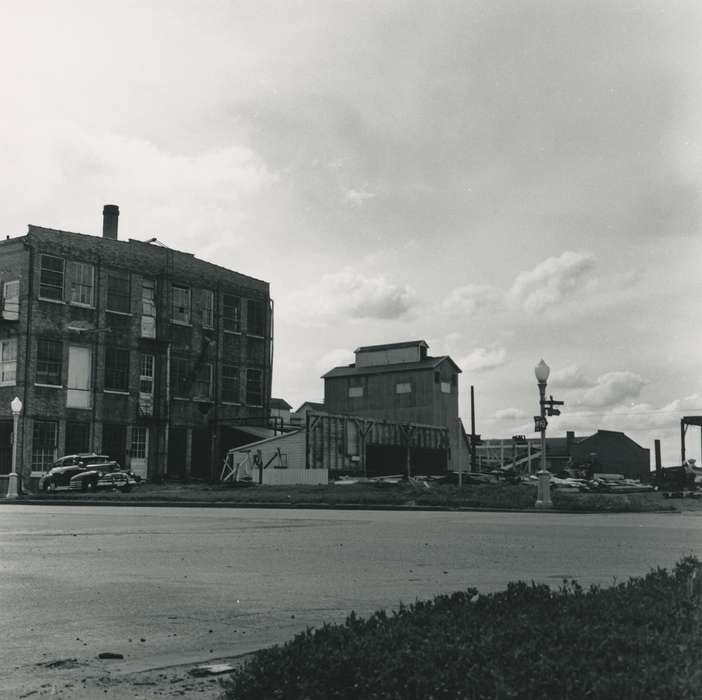 Motorized Vehicles, Iowa History, Waverly Public Library, Iowa, history of Iowa, Businesses and Factories, correct date needed, brick building, car, debris, Waverly, IA, street light, street