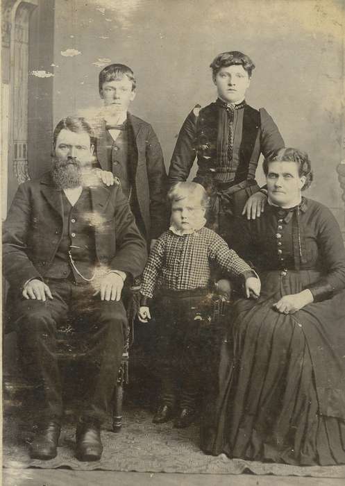 Portraits - Group, vest, bow tie, pocket watch chain, IA, Families, girl, siblings, man, cabinet photo, mustache, dress, sack coat, history of Iowa, Iowa History, beard, woman, ribbon, Olsson, Ann and Jons, Iowa, family, boy, painted backdrop
