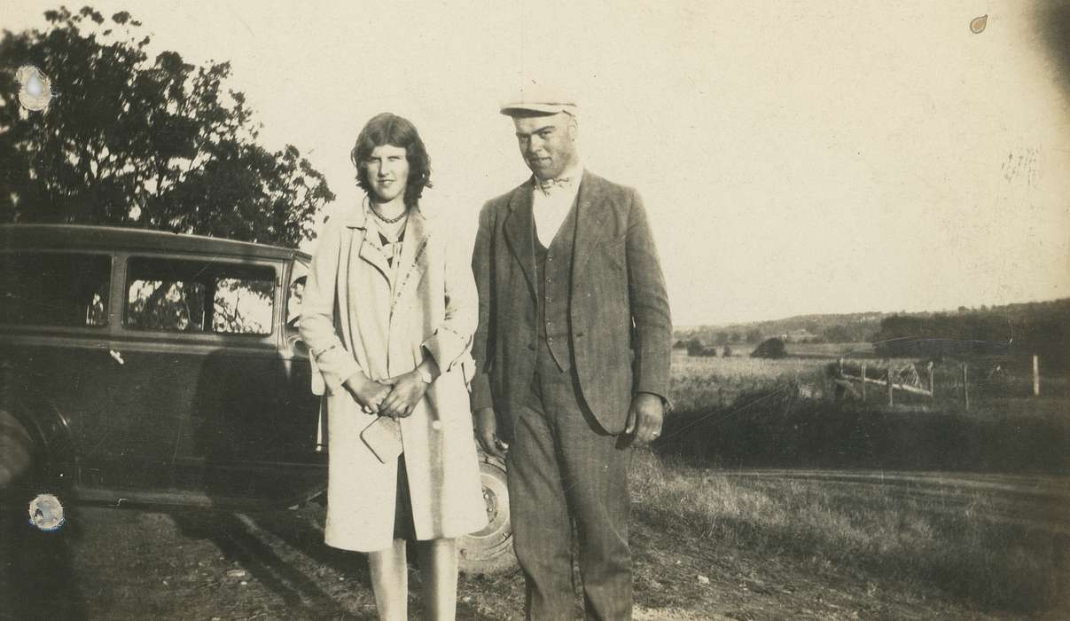 Portraits - Group, Floris, IA, Iowa, couple, woman, outside, cap, overcoat, car, man, history of Iowa, Motorized Vehicles, Spilman, Jessie Cudworth, Iowa History