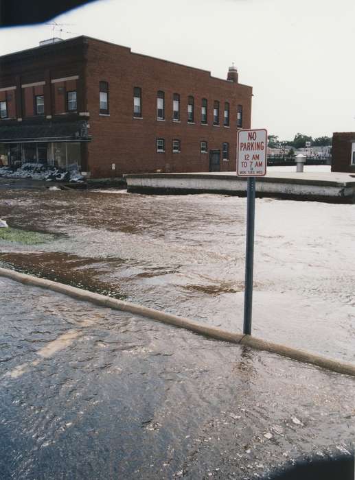 Cities and Towns, Floods, sign, Iowa History, sandbag, Waverly Public Library, Iowa, street sign, water, history of Iowa, parking lot, brick, Waverly, IA