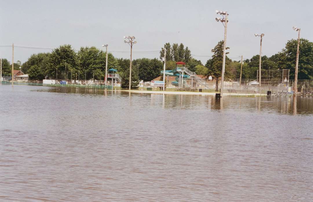 pool, Floods, history of Iowa, Iowa History, trash can, water slide, fairgrounds, Waverly, IA, swimming pool, water, street light, Iowa, fence, Waverly Public Library, park