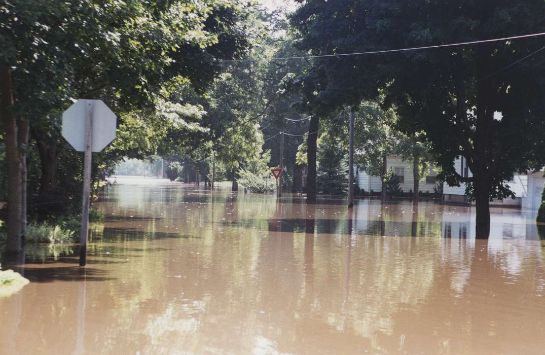 Cities and Towns, yield sign, Floods, Homes, tree, Waverly Public Library, street, Waverly, IA, Iowa, water, history of Iowa, Iowa History, stop sign, telephone pole