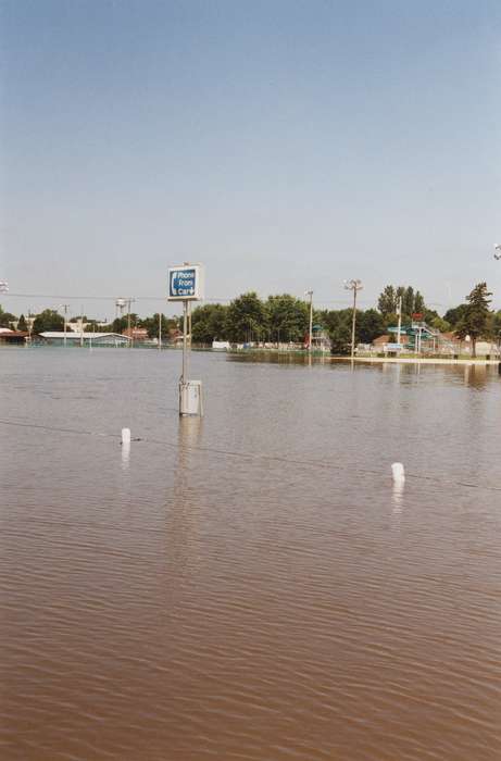 Floods, telephone, phone booth, Iowa History, history of Iowa, water slide, fairgrounds, Waverly, IA, phone, water, Iowa, Cities and Towns, Waverly Public Library, pool