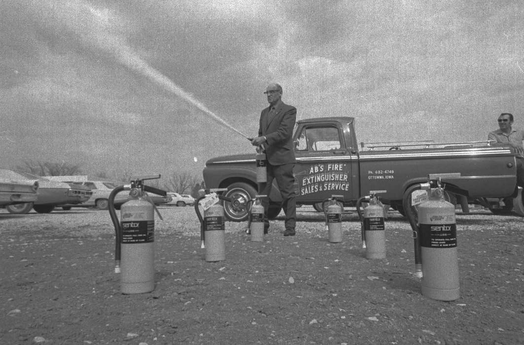 Businesses and Factories, suit, Iowa History, Iowa, Motorized Vehicles, parking lot, Lemberger, LeAnn, Ottumwa, IA, truck, fire extinguisher, history of Iowa