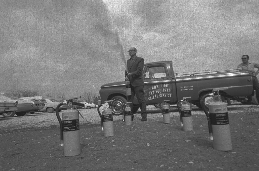 history of Iowa, Iowa History, Ottumwa, IA, truck, Motorized Vehicles, Businesses and Factories, parking lot, spray, fire extinguisher, Iowa, Lemberger, LeAnn, suit