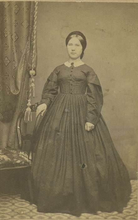 carte de visite, Iowa, Beliot, WI, woman, bishop sleeves, chair, patterned carpet, hoop skirt, Olsson, Ann and Jons, Portraits - Individual, hairnet, history of Iowa, lace collar, collared dresses, brooch, dropped shoulder seams, Iowa History