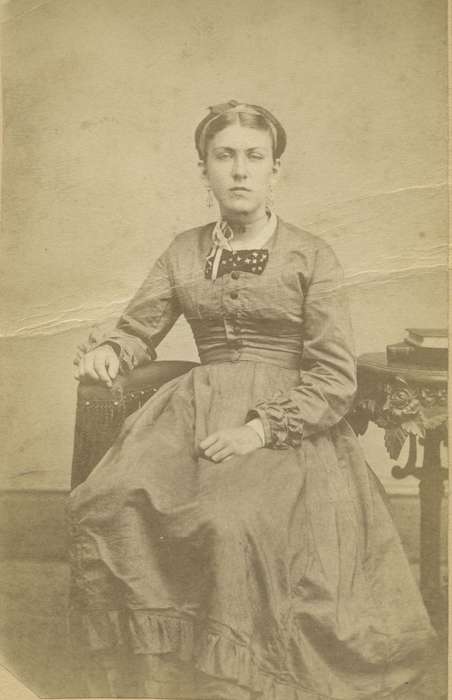 bow tie, hoop skirt, ruffles, history of Iowa, Iowa History, woman, book, ribbon, Maquoketa, IA, earrings, dropped shoulder seams, necklace, Iowa, Olsson, Ann and Jons, dress, carte de visite, Portraits - Individual