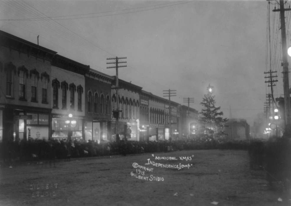 mainstreet, Main Streets & Town Squares, streetlights, christmas, history of Iowa, Iowa History, Entertainment, Families, Winter, storefront, Businesses and Factories, Library of Congress, dirt road, Fairs and Festivals, Holidays, Iowa, Cities and Towns, correct date needed