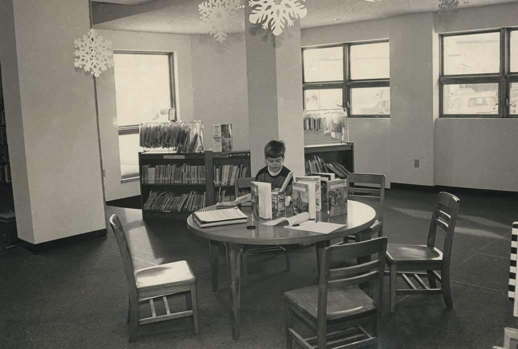 table, Waverly Public Library, history of Iowa, Iowa History, Winter, book, bookshelf, chair, snowflake, table and chairs, Shell Rock, IA, Iowa, boy, Children, Leisure