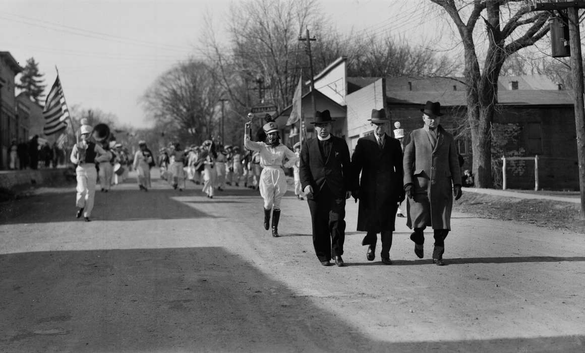 Iowa, parade, coat, fedora, telephone pole, Entertainment, dirt road, Lemberger, LeAnn, Cities and Towns, marching band, history of Iowa, flag, Main Streets & Town Squares, Iowa History, Melrose, IA