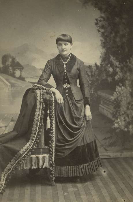 fringe, Iowa, necklace, woman, jewelry, Tipton, IA, chair, Olsson, Ann and Jons, Portraits - Individual, dress, bangs, painted backdrop, pleats, history of Iowa, cabinet photo, Iowa History