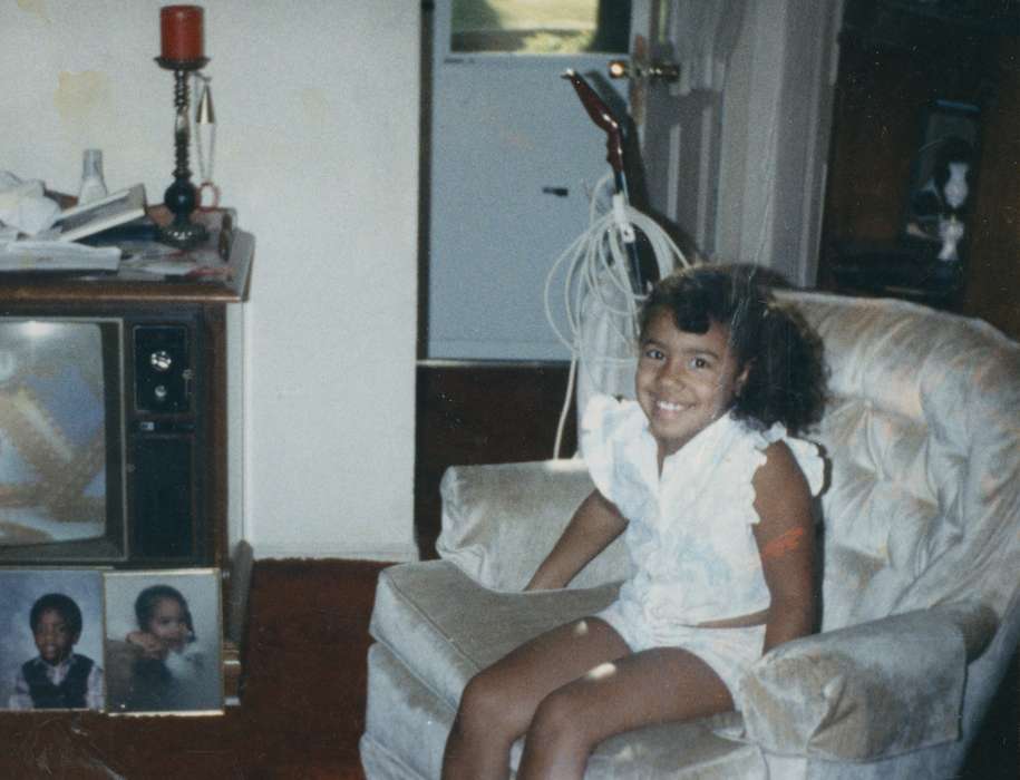 african american, People of Color, history of Iowa, IA, Iowa History, girl, Moore, Mildred, chair, Iowa, living room, Homes, Children, Portraits - Individual