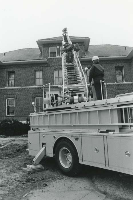 history of Iowa, Iowa History, Motorized Vehicles, Civic Engagement, Waverly, IA, fire truck, cross, Iowa, helmet, dirt, ladder, roof, Waverly Public Library, Religion, Labor and Occupations