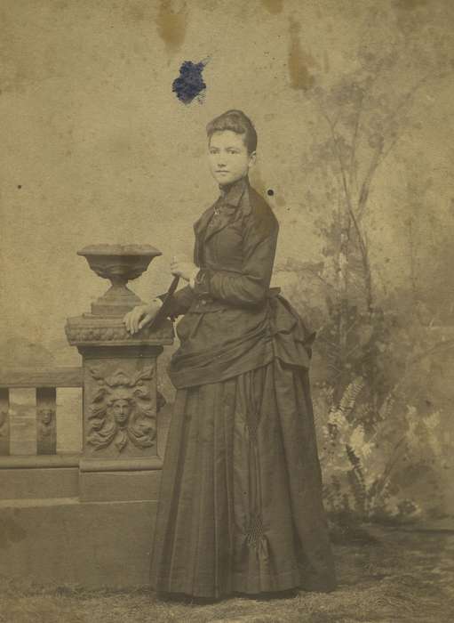 bustle, history of Iowa, Iowa History, woman, Webster City, IA, Olsson, Ann and Jons, cabinet photo, pleats, fence, painted backdrop, Iowa, Portraits - Individual