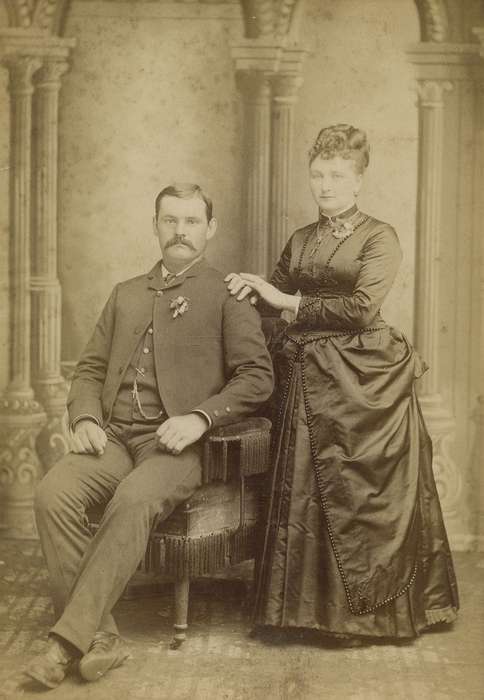 Portraits - Group, brooch, bustle, hairstyle, IA, history of Iowa, Iowa History, woman, couple, Olsson, Ann and Jons, corsage, man, cabinet photo, Iowa, painted backdrop, mustache, dress