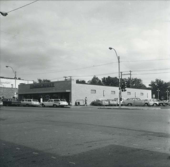 Main Streets & Town Squares, main street, grocery store, cars, Iowa History, history of Iowa, Businesses and Factories, parking lot, traffic light, Iowa, Cities and Towns, street, Waverly Public Library