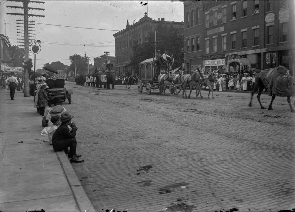 Children, umbrella, hat, boy, history of Iowa, Waverly Public Library, Main Streets & Town Squares, Iowa, horse, wagon, camel, elephant, Iowa History, Cities and Towns, parade, Animals, Fairs and Festivals