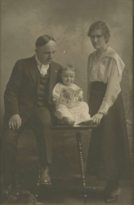 Portraits - Group, baby, Iowa, Iowa History, Families, reading, Joram, Elana, hairstyle, book, Garner, IA, history of Iowa, suit