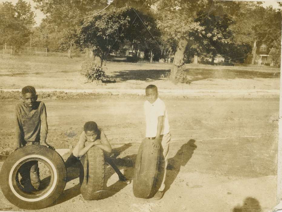 Waterloo, IA, street, summer, Barrett, Sarah, history of Iowa, tire, tires, Iowa, friends, field, Leisure, trees, Children, dirt, People of Color, Iowa History, Portraits - Group, african american