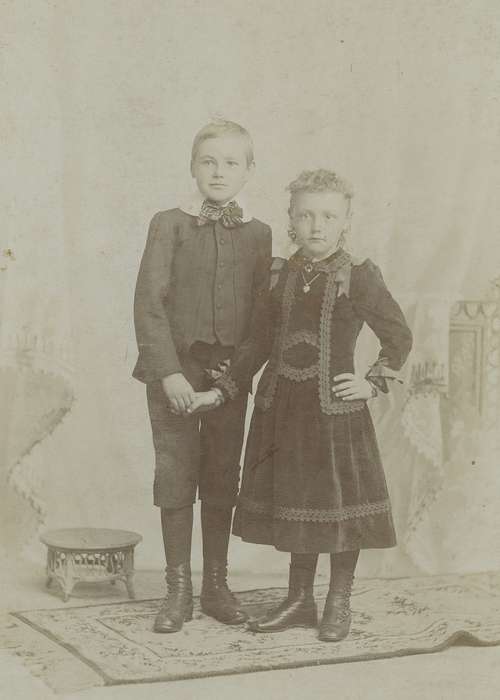 cabinet photo, siblings, knickers, ribbon, Atlantic, IA, painted backdrop, history of Iowa, Iowa, fields, sister, Olsson, Ann and Jons, Iowa History, necklace