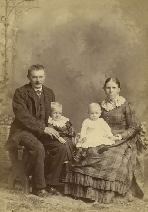 Portraits - Group, baby, boy, Atlantic, IA, Iowa, couple, woman, Families, Children, bench, Olsson, Ann and Jons, history of Iowa, painted backdrop, lace collar, man, brooch, cabinet photo, Iowa History