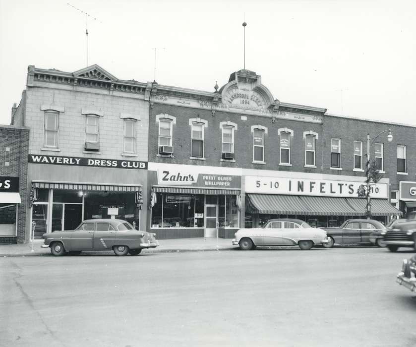 Cities and Towns, clothing store, brick building, storefront, paint store, main street, Waverly Public Library, Main Streets & Town Squares, cars, street, stores, Iowa, history of Iowa, Iowa History, Businesses and Factories