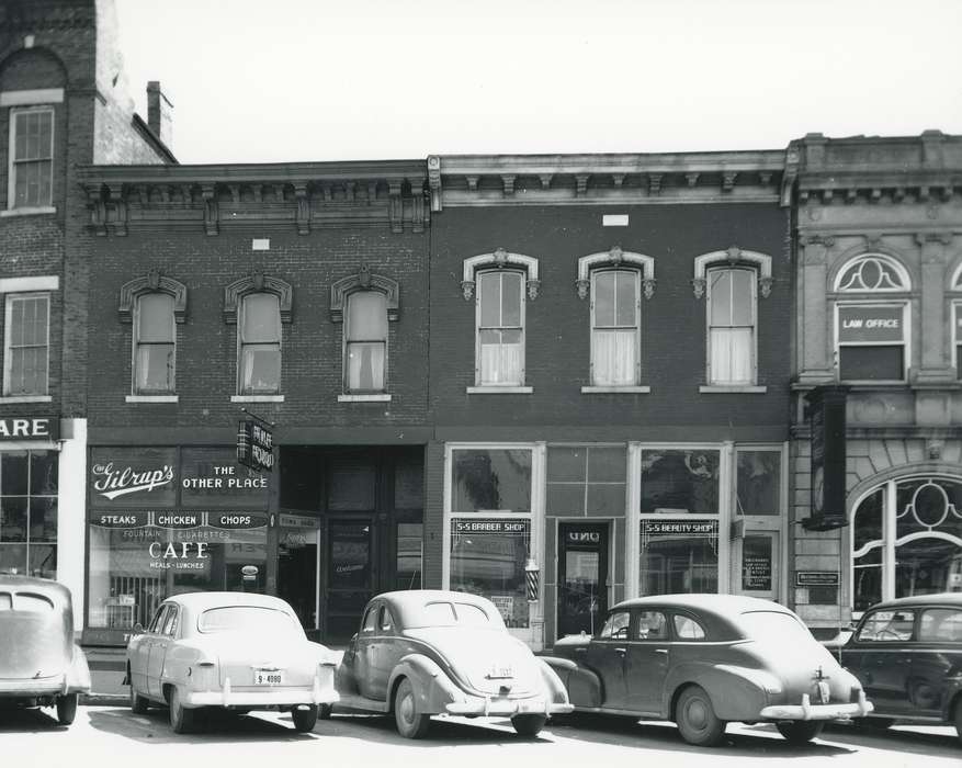 license plate, sign, history of Iowa, window, Businesses and Factories, Waverly, IA, Waverly Public Library, Main Streets & Town Squares, Iowa, car, Motorized Vehicles, cafe, brick building, barbershop, building, Iowa History, Cities and Towns