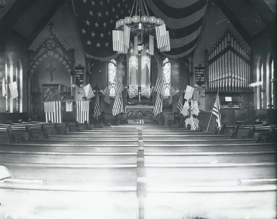 pipe organ, history of Iowa, Religious Structures, Iowa History, Civic Engagement, american flag, pews, Waverly, IA, Iowa, catholic church, Waverly Public Library, building interior