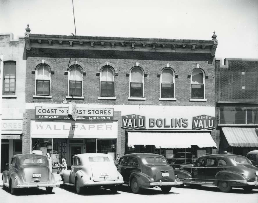 license plate, Main Streets & Town Squares, history of Iowa, Iowa History, Motorized Vehicles, Businesses and Factories, window, brick building, car, window display, Waverly, IA, building, Iowa, Cities and Towns, sign, Waverly Public Library