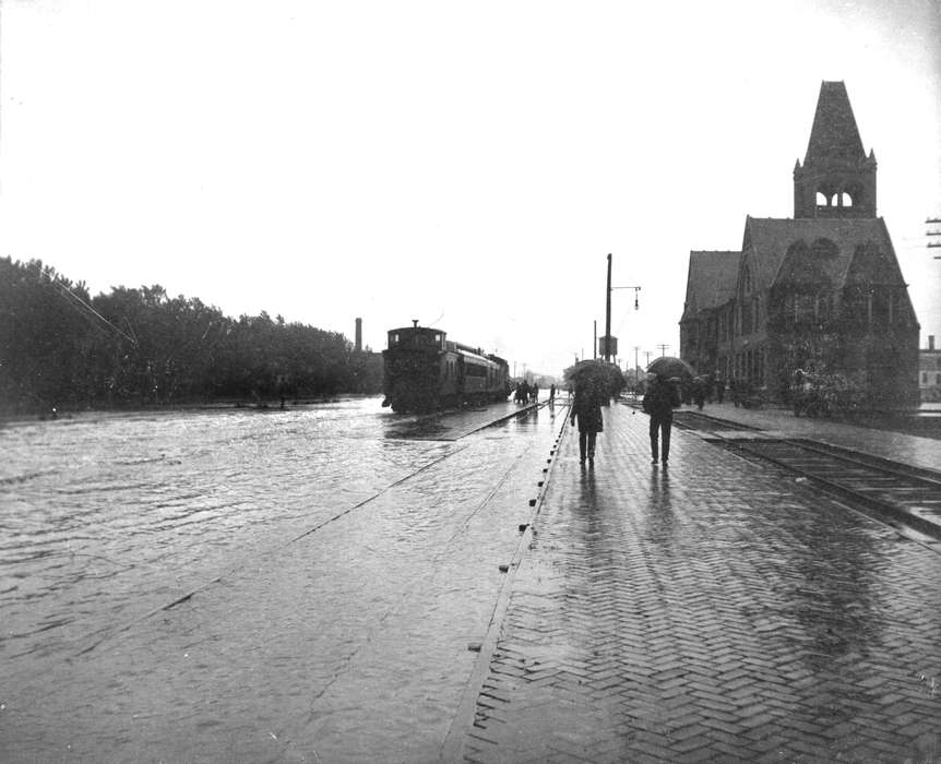 brick street, train track, Ottumwa, IA, Floods, history of Iowa, Lemberger, LeAnn, train, Iowa, Iowa History, umbrella