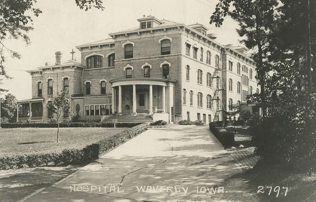 Hospitals, veranda, Iowa History, Iowa, history of Iowa, lawn, driveway, Meyer, Sarah, cross, Waverly, IA, bushes